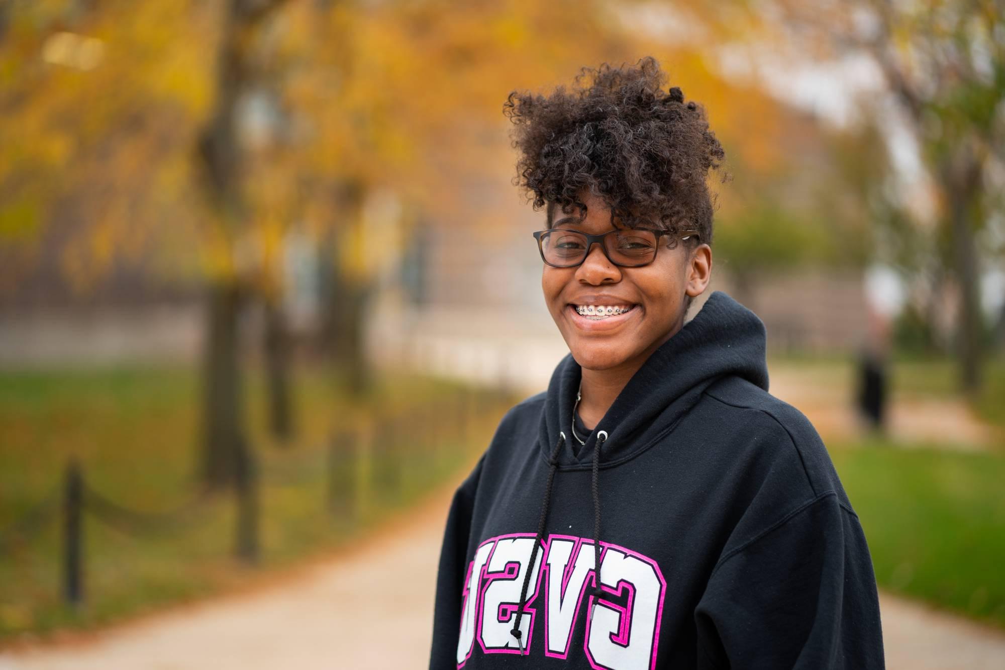 Student smiling on GVSU campus